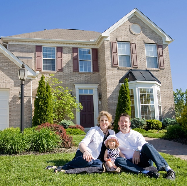 Family In Front Of Their House